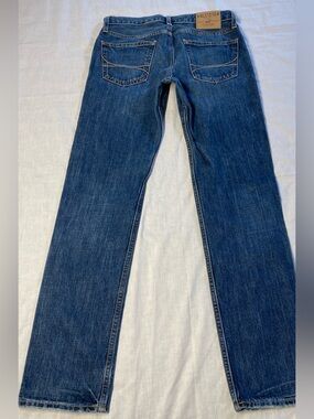 Hollister Dark Blue Denim Jeans with Tan Leather Patch